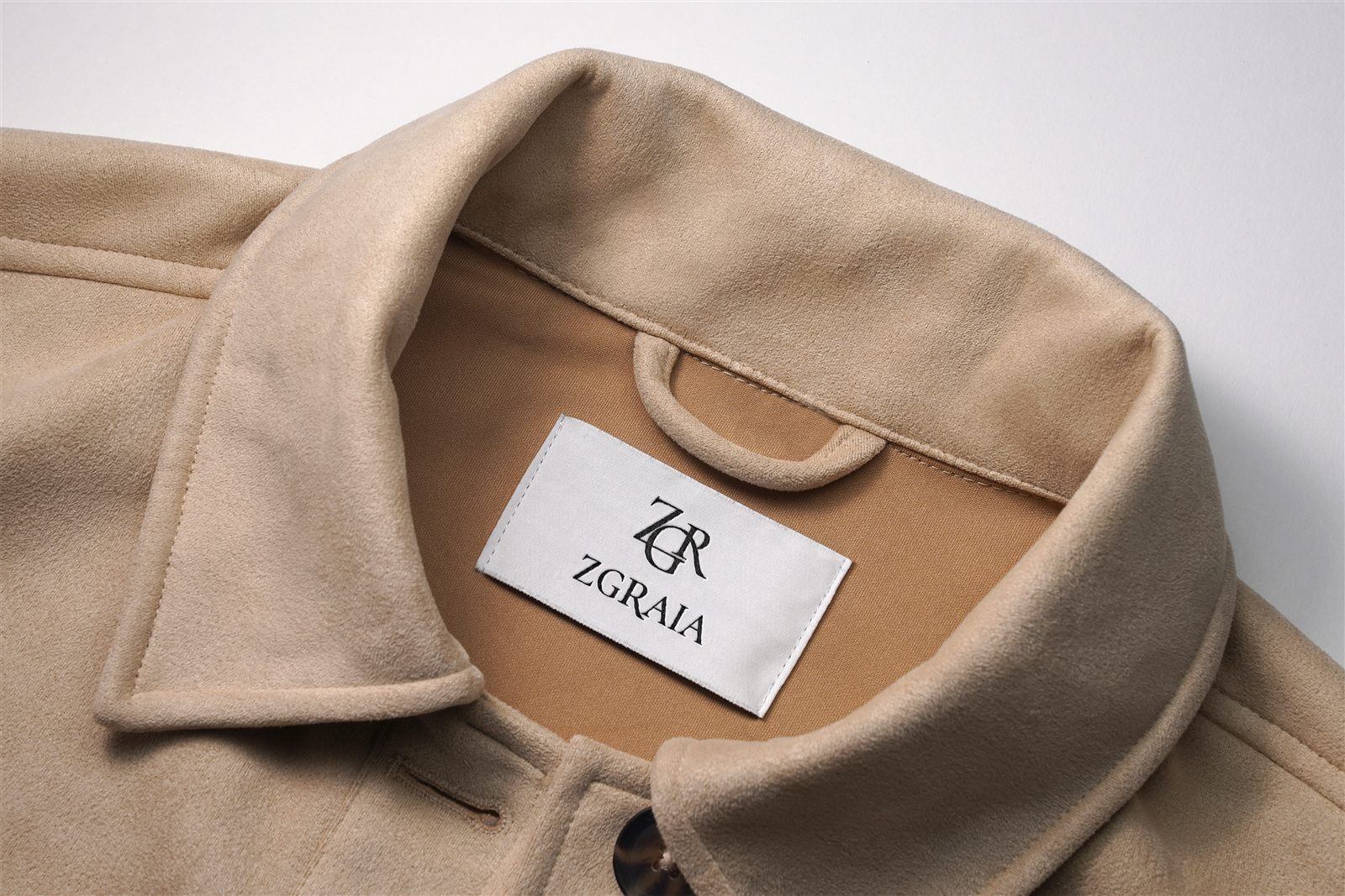 ZGRAIA woven label inside a camel coat